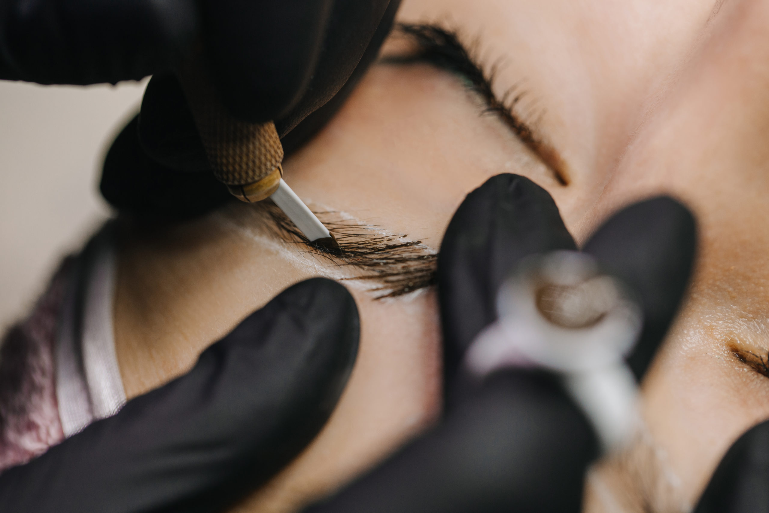 A girl receiving microblading treatment in a spa